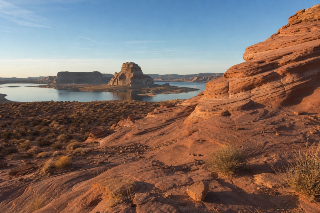 Desert landscape near Page Arizona under low winter sun with long shadows